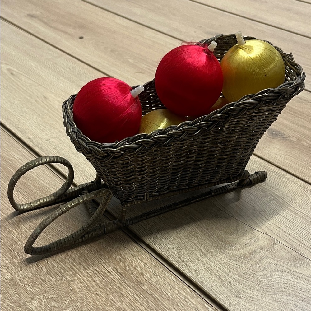 Elegant Wicker Sleigh with Red and Gold Baubles